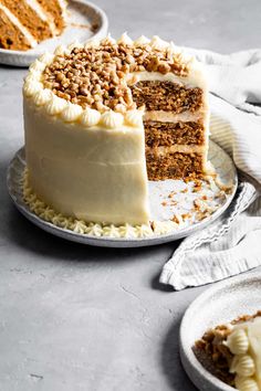 two plates with slices of cake on them and one slice has been cut from it