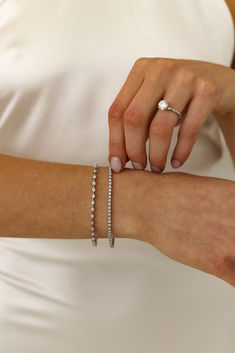 Looking for the perfect anniversary gift? How about a classic tennis bracelet that sparkles just like your love? Explore stunning diamond bracelets for a gift they’ll never forget. Need more anniversary ideas? Click the link to start exploring Minimalist Single Cut Diamond Tennis Bracelet For Wedding, Dainty Diamond Accents Tennis Bracelet For Anniversary, Fine Jewelry Diamond Bracelet With Prong Setting, Fine Jewelry Diamond Bracelet With Round Cut, Dainty Diamond White Tennis Bracelet For Formal Occasions, Dainty Diamond Bracelet With Round Cut Accents, Adjustable Brilliant Cut Tennis Bracelet, Adjustable Brilliant Cut Round Tennis Bracelet, Adjustable Tennis Bracelet With Brilliant Cut