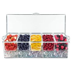 a plastic container filled with lots of different types of berries and strawberries in it