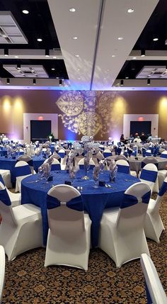 a banquet room with blue and white linens