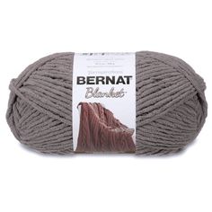 bernat blanket yarn ball in grey, with brown and white logo on the side