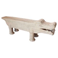 a white bench made out of wicker on a white background