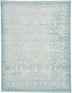 a light blue and white rug with an intricate design on the bottom, in front of a