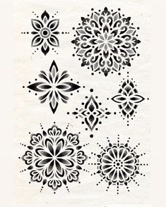 some black and white designs on paper