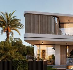 a modern house with large balconies and palm trees