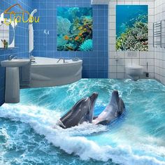 two dolphins are swimming in the ocean with blue tiles on the walls and flooring