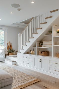 a living room filled with lots of white furniture