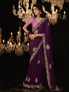 Embrace tradition and radiate glamour in this captivating purple saree. Exquisite ethnic embroidery dances alongside shimmering sequins, creating a masterpiece. The contrasting pink blouse  adds a touch of whimsy. Unveil your inner goddess at weddings, festivals, or any special occasion. Wine Color Saree, Tissue Silk Saree, Purple Saree, Casual Saree, Contrast Blouse, Purple Fabric, Wine Color, Fancy Sarees, Party Wear Sarees