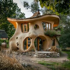 an unusual house in the middle of a forest