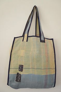 a handmade bag hanging on the wall