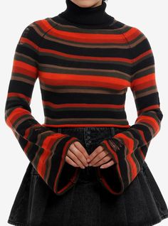 Who else is ready for temps to dip? This cropped turtleneck sweater will have you feeling like fall  thanks to its orange  brown  black and dark green stripes  bell sleeves and faux distressing. 100% acrylicWash cold; dry flatLength: 16 12"ImportedListed in junior sizesModel is 5'8"Model wears size Small Cropped Turtleneck Sweater, Punk Street Style, Girls Turtleneck, Cropped Turtleneck, Emily The Strange, Hot Sweater, Orange Outfit, Halloween Sweater, Orange Sweaters