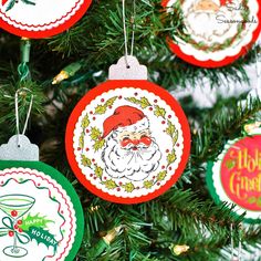 christmas ornament ornaments hanging from the top of a christmas tree with santa clause on it