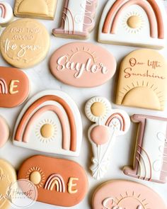 cookies decorated with pastel colors and the words sager are laid out on a table