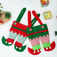 two christmas stockings are sitting on the table