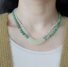 This handmade antique style mint jade Huang (璜) necklace is for a mysterious Asian touch. In the Divine Land, Jade is respected as the emperor of all gemstones. It represents eleven virtues, including a noble character, grace, loyalty, intelligence, and sincerity.⚜ Specifics❀ Mint Jadeite 2-4mm & Faceted Moonstone 2-3mm ❀ Green Jadeite 6mm & Fresh Water Pearl 2mm❀ Mint Jade Huang 0.5" x 1.75" (12m x 45m) ❀ Length 16 in. Green Jade Necklace, 16 Inch Necklace, The Emperor, Jade Necklace, White Jade, Green Jade, Jade Green, Antique Style, Double Layer