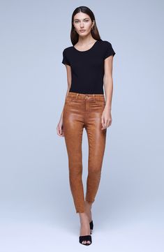 Coated for a sleek sheen, these skinny crop jeans with a high waist polish your look without any effort at all. 26" inseam; 10" leg opening; 10 1/2" front rise; 14 1/2" back rise (size 29) Zip fly with button closure Five-pocket style 86% cotton, 11% elastane, 3% spandex Spot clean only Made in the USA of Imported fabric Women's Clothing Denim Party, Brown Fits, Pink Coat, Brown Coat, Crop Jeans, Denim Coat, Colored Denim, Premium Denim, Winter Collection