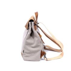 Our urban-inspired Cooper Canvas Backpack features a chic appearance and offers a roomy interior that lets you tote all your essentials. A single shoulder strap and a top loop give you versatile carrying options that can convert from backpack to crossbody in seconds..Material- vegetable base dyes, interior cotton lining, cotton canvas, genuine leather accents; hardware- alloy, solid brass or copper.Small sized bag, 12' W x 15' H x 5' D.Handle drop- 3', shoulder strap drop- 24'.Zipper closure.Int Modern Backpack With Adjustable Strap For On-the-go, Trendy Canvas Satchel Backpack, Trendy Beige Backpack With Adjustable Straps, Beige Canvas Satchel Backpack, Urban Style Canvas Travel Bag, Travel Backpack With Adjustable Straps In Canvas, Urban Travel Canvas Bag, Urban Canvas Travel Bag, Urban Canvas Backpack