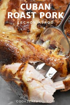 a close up of food on a plate with a fork in it and the words cuban roast pork