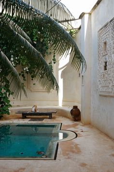 an indoor swimming pool in the middle of a courtyard