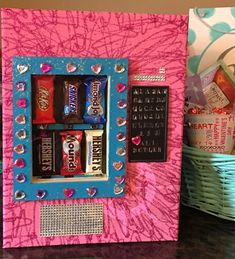 a pink and blue box with candy in it