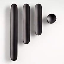 three black objects are placed next to each other