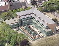 an aerial view of a large green building