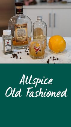 the ingredients to make an alcoholic cocktail are displayed on a counter with oranges and coffee beans