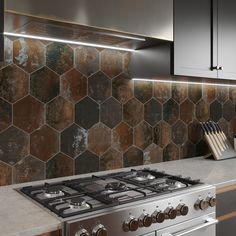 a stove top oven sitting inside of a kitchen next to a wall mounted oven hood