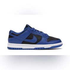 The Nike Dunk Low Retro Black Hyper Cobalt Brings Familiar Color Blocking To The Basketball Silhouette, Sharing A Flipped Design Of The Classic Air Jordan 1 Royal. The Nike Dunk Low Retro Black Hyper Cobalt (2021) Features A Mix Of Black And Hyper Cobalt Leather Overlays Throughout The Upper. Traditional "Nike" Branding Is Embroidered In Black On The Heel. A Black And Hyper Cobalt Nike Logo Tongue Tag Is Stitched Atop A Nylon Tongue. To Finish Off The Design Is A Hyper Cobalt Outsole. New In Box Nike Blue Sneakers, Nike Jordan 1 Low, Bright Sneakers, Jordan 1 Royal, Basketball Silhouette, Nike Branding, Nike Air Jordan 6, Nike Airforce 1, Nike Air Jordan 11