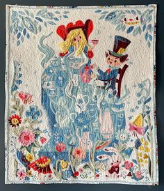 a quilted wall hanging with an image of alice and the wonderland tea party on it