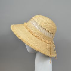 Such a cute summer hat in retro look! Perfect for the holiday but also for a relaxed look in the city. Made of raffia straw braids, finely woven. High quality. Bucket hat with large brim and frayed edges. Only in natural straw colour available. Self-adjustable band inside for the size. Fits sizes between 55 and 59 cm. Brim length: 10 cm All of my hats are handmade, using high-quality millinery standards. Every style can be made to customers' requests (size, colour), as long as it is possible. Pl Casual Straw Bucket Hat For Warm Weather, Natural Straw Casual Bucket Hat, Natural Woven Bucket Hat With Short Brim, Natural Woven Straw Bucket Hat, Natural Straw Bucket Hat With Curved Brim, Casual Straw Bucket Hat In Natural Color, Beige Toquilla Straw Bucket Hat With Flat Brim, Casual Natural Straw Bucket Hat, Beige Straw Hat For Summer Vacation