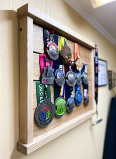 a wall mounted medal rack with medals on it