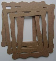 several pieces of cardboard cut out to look like frames