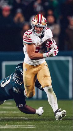 a football player is running with the ball