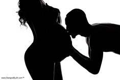 the silhouette of a woman and a man kissing in front of a white background is shown