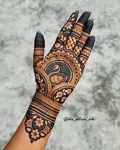 the hand is decorated with intricate designs