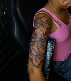 a woman with a tattoo on her arm