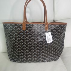 Goyard Brand New With Tags St. Louis Tote. Dust Bag Included. Retail Tags Attached. ***Plastic On Handles Has Come Off /Fallen Off Since Photos Taken But Still New - Date Code 2023 ***Open To Negotiations Or Offers - Receipt Available Upon Request - Please Reach Out With Any Questions. Serious Buyers Only And Please No Low Ball Offers Classic Bag. Traditional Classic Colors! The Saint Louis Pm Bag Is Made From Goyardine And Is Unlined. It Is Extremely Light And Completely Reversible. Wear It Sho High-end Brown Coated Canvas Bag, Luxury Brown Shoulder Bag For Shopping, Black Large Capacity Monogram Canvas Bag, Black Monogram Canvas Shoulder Bag For Shopping, Brown Coated Canvas Bag For Everyday Luxury, Luxury Brown Shoulder Bag For Errands, Luxury Everyday Bags With Leather Handles And Coated Canvas, Brown Tote Bag For Everyday Luxury, Everyday Black Monogram Canvas Shoulder Bag