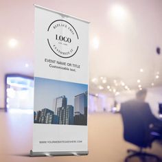 a roll up banner stands in front of a conference room with chairs and desks