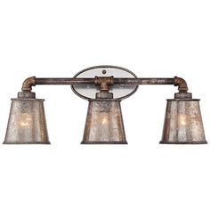 three light bathroom fixture in an old fashioned style with glass shades and metal fittings