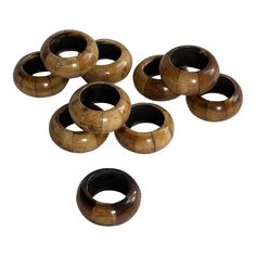 six wooden rings sitting on top of each other