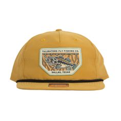 a yellow hat with a fish patch on it