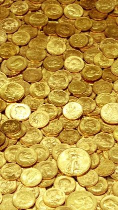 a pile of gold coins sitting on top of each other