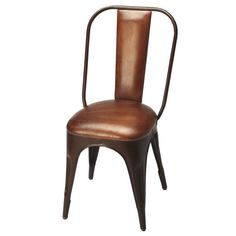 a brown leather chair sitting on top of a white floor