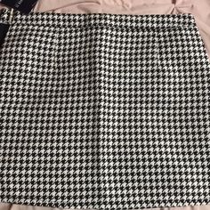 Black And White Gingham Skirt. I'm 5 Feet Tall And It Goes Down To Around My Knees. New With Tags Never Worn Before Great Condition!! Spring Black Houndstooth Skirt, Black Houndstooth Skirt For Spring, Casual Houndstooth Skirt For Summer, Casual Black Houndstooth Mini Skirt, Black Houndstooth Mini Skirt, Black Mini Skirt With Houndstooth Pattern, Trendy Black Houndstooth Skirt, Trendy Black Skirt With Houndstooth Pattern, Spring Houndstooth Mini Skirt