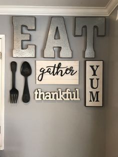 the wall is decorated with metal letters and utensils