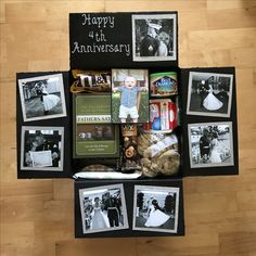 a box filled with pictures and other items on top of a wooden floor in front of a sign that says happy 4th anniversary