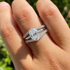 a woman's hand with a ring on it and two bands around the band