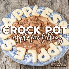 crock pot appetizer filling on a blue and white plate with the words crock pot appetizing over it