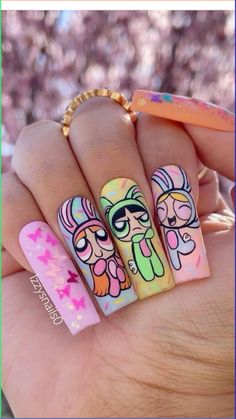 Step into the Easter vibe with these 21 fantastic nail designs! Whether it's adorable bunnies or vibrant eggs, we've got you covered to... Nail Character Art, Nails With Cartoon Characters, Disney Acrylic Nail Designs, Disney Character Nail Designs, Power Puff Nails, Cute Cartoon Nails, Powerpuff Nails, Cartoon Character Nails